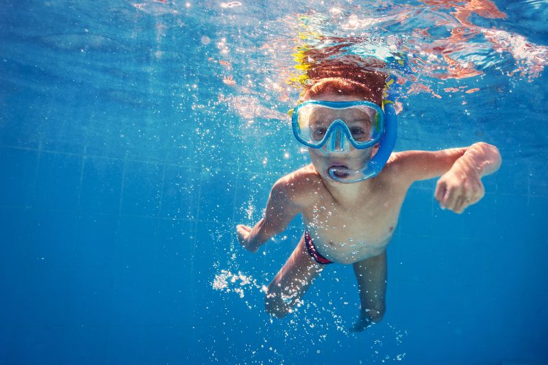 kid swimming in a pool